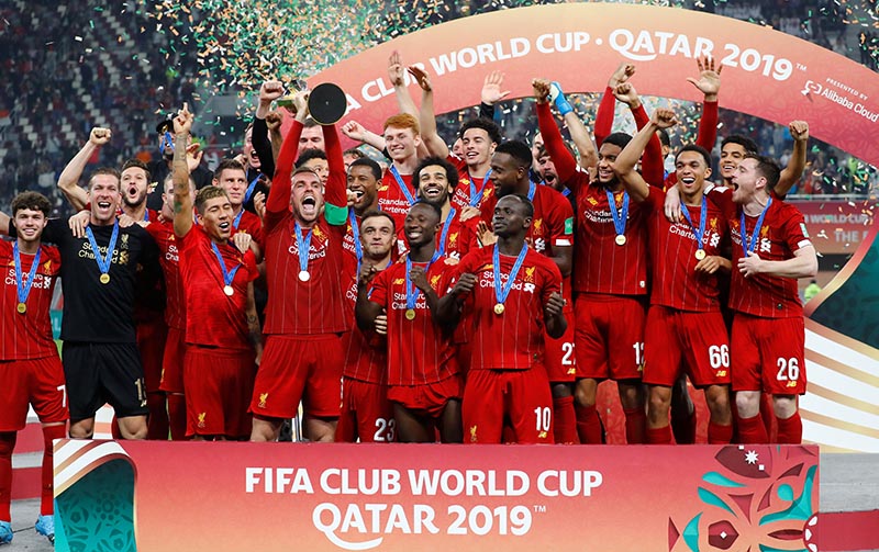 Liverpool's Jordan Henderson lifts the trophy as they celebrate after winning the Club World Cup  during the Club World Cup Final match between Liverpool and Flamengo, at Khalifa International Stadium, in Doha, Qatar, on December 21, 2019. Photo: Reuters