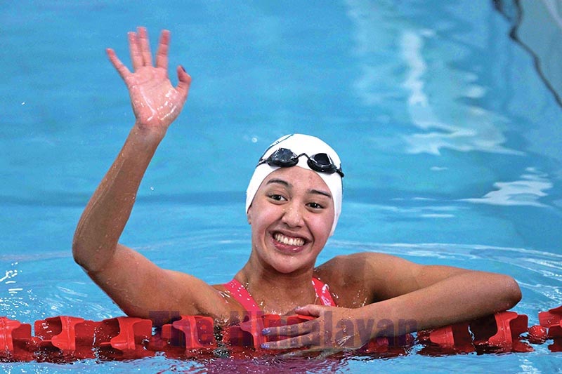 Gaurika Singh waving to her supporters after winning a gold medal in the womenu2019s swimming 200 metres freestyle final during the 13th South Asian Games at International Sports Complex swimming pool, Satdobato, Lalitpur, on Thursday, December 5, 2019. Photo: THT