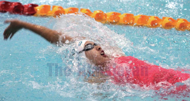 Gaurika Singh swims in women's 100 metres backstroke final in swimming during the 13th South Asian Games at International Sprots Complex Swimming Pool, Satdobato in Lalitpur on Saturday, December 7, 2019. Photo: Udipt Singh Chhetry/THT
