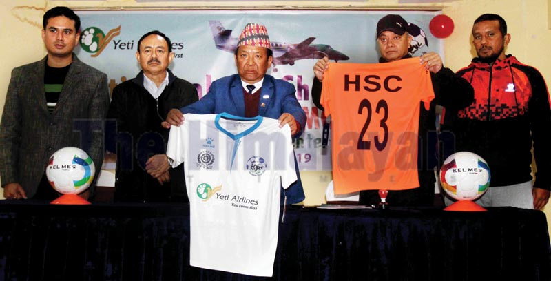Himalayan Sherpa Club President Karma Tshiring Sherpa (centre) and Sales and Marketing Director of Yeti Airlines Saral Shumsher Rana unveiling the new jersey during a signing ceremony in Kathmandu on Monday, December 16, 2019. Photo: THT