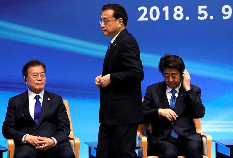 FILE PHOTO: Japan's Prime Minister Shinzo Abe, South Korea's President Moon Jae-in and China's Premier Li Keqiang attend the 6th JAPAN-CHINA-KOREA Business Summit in Tokyo, Japan May 9, 2018. Photo: Reuters