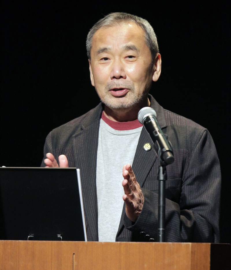 In this photo provided by Shinchosa, author Haruki Murakami speaks on stage in Tokyo, Tuesday, Dec 17, 2019. Photo: Shinchosa via AP)