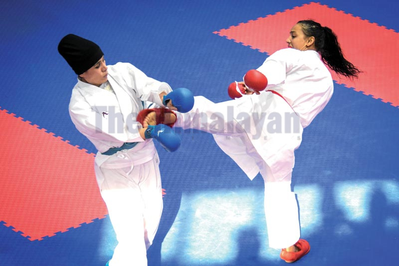Nepalu2019s Sunita Maharjan fights with Pakistanu2019s Kulsum in karate tournament under the 13th South Asian Games in Lalitpur on Tuesday, December 4, 2019. Photo: Naresh Shrestha / THT