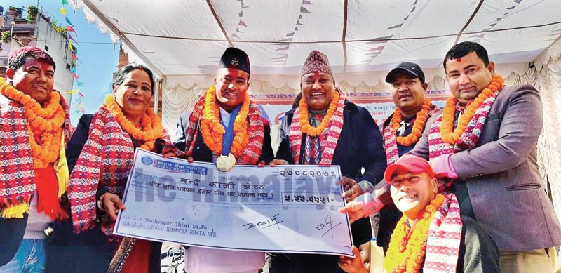 Karateka Manday Kaji Shrestha (second from left) poses for a photo with officials after being felicitated by Madhyapur Thimi Municipality in Bhaktapur on Saturday, December 14, 2019. Photo: THT