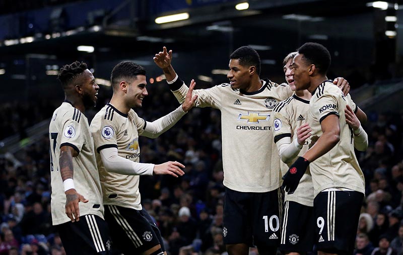 Manchester United's Anthony Martial celebrates scoring their first goal with teammates during the Premier League match between Burnley and Manchester United, at Turf Moor, in Burnley, Britain, on  December 28, 2019. Photo: Action Images via Reuters