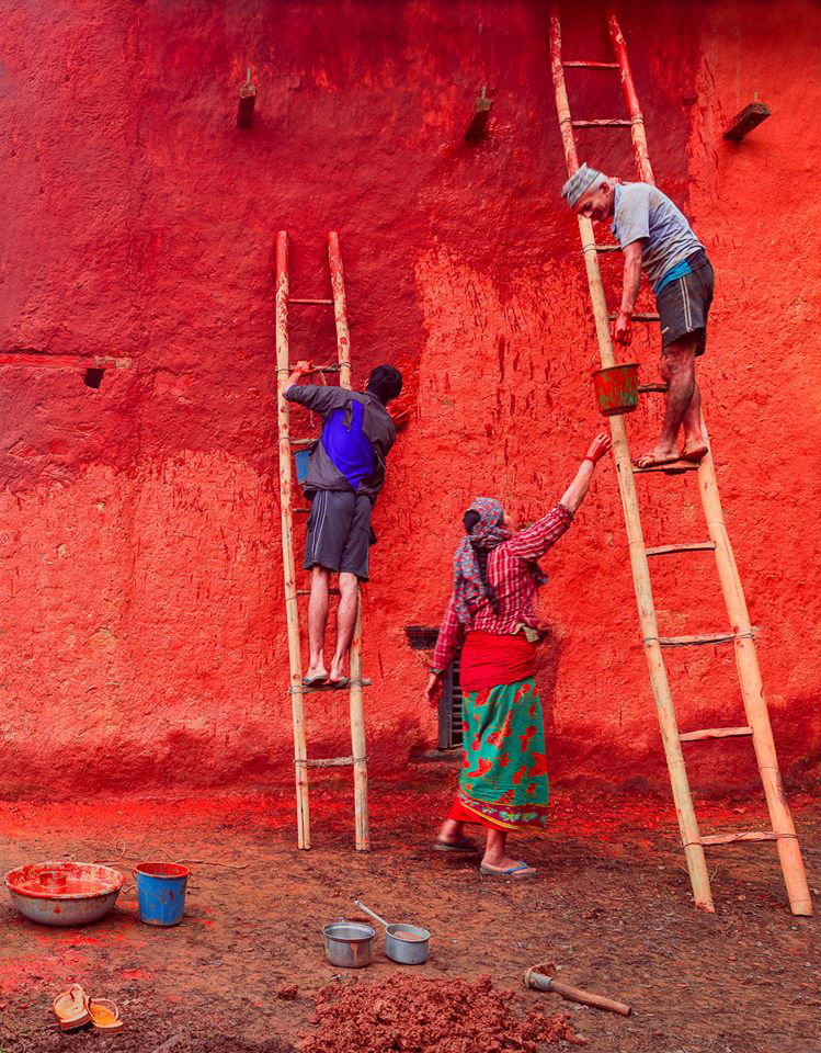 The photograph taken by Mithun Kunwar, winner of the photo competition, displays people painting a house ahead of Dashain in Palpa. Photo Courtesy: Nepal Academy of Fine Arts