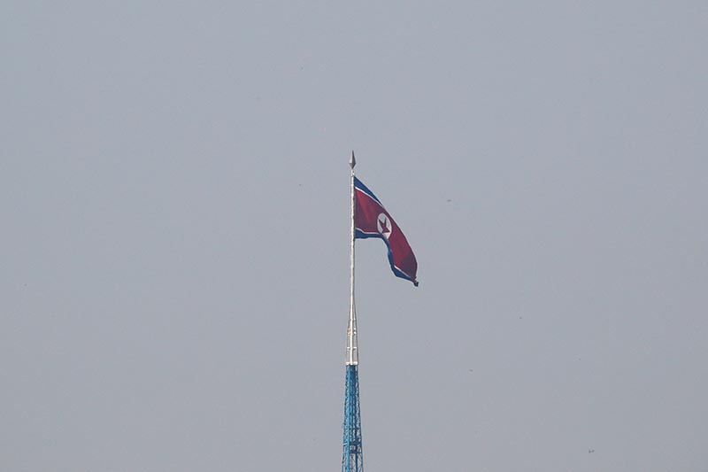 FILE - A North Korean flag flutters on top of the 160-metre tall tower at North Korea's propaganda village of Gijungdong, in this picture taken from Tae Sung freedom village near the Military Demarcation Line (MDL), inside the demilitarised zone separating the two Koreas, in Paju, South Korea, on September 30, 2019. Photo: Reuters