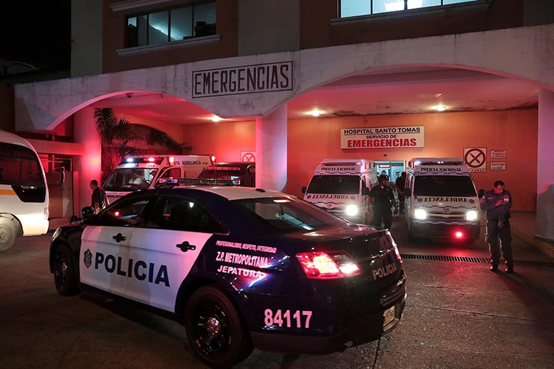 A police patrol car is seen outside a hospital where injured inmates were taken following a shootout among inmates at La Joyita prison, in Panama City, Panama December 17, 2019. Photo: Reuters