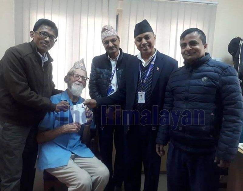 British national Collin Philip Smith, popularly known as Putali Baje, receiving an honorary Nepali citizenship certificate, in Kathmandu, on Monday. Photo: THT