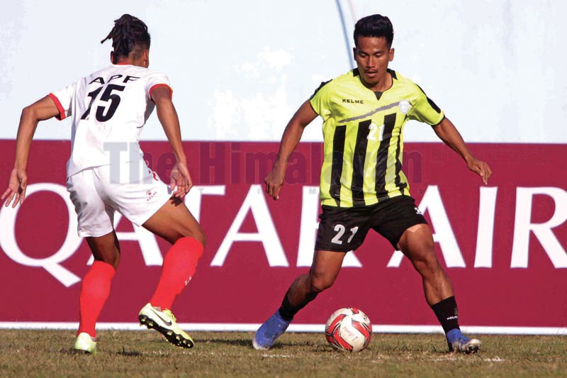 MMC’s Bimal Rana (right) and APF’s Rajan Gurung vie for the ball during their Qatar Airways Martyrs Memorial ‘A’ Division League match in Kathmandu on Wednesday, December 18, 2019. Photo: Udipt Singh Chhetry / THT