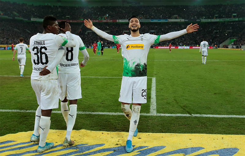Borussia Moenchengladbach's Ramy Bensebaini celebrates scoring their second goal. Photo: Reuters