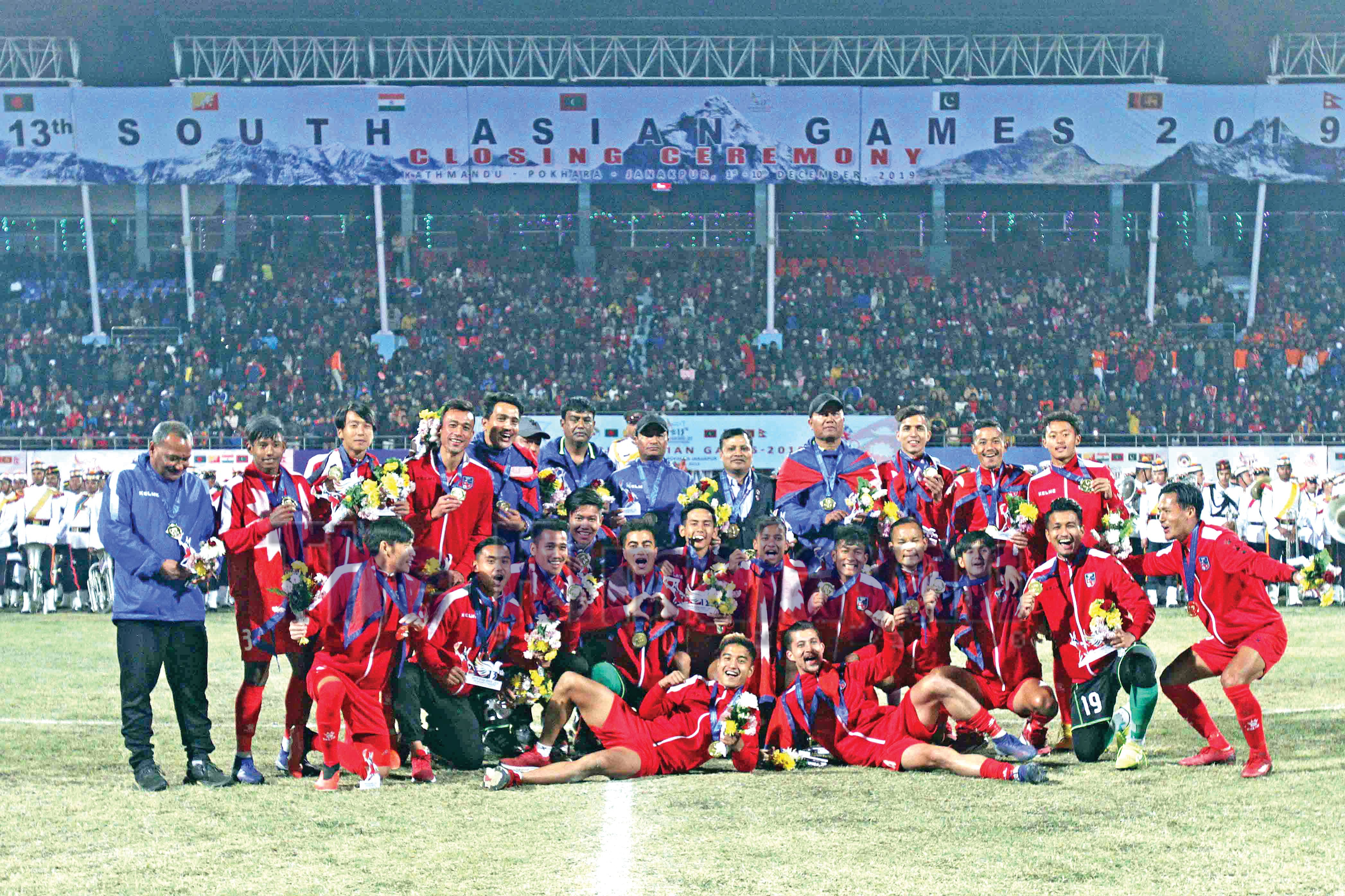 Nepali men's football team players &amp; officials celebrate after winning gold medalat the Dasharath Stadium in Kathmandu on Tuesday, December 10, 2019. Photo: udipt Singh Chhetry/ THT