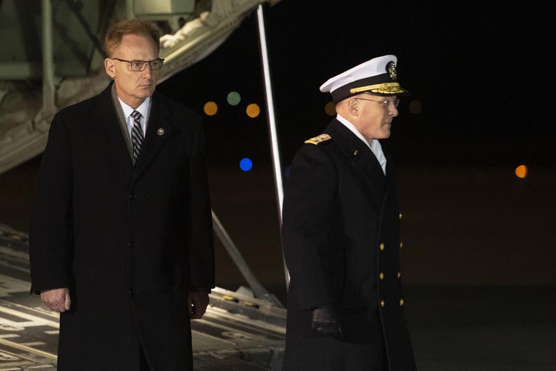 Acting Navy Secretary Thomas Modly, left, and Navy Admiral Michael Gilday, Chief of Naval Operations, participate in the dignified transfer for Navy Ensign Cameron Scott Walters, Seaman Mohammed Sameh Haitham and Seaman Apprentice Cameron Scott Walters, Sunday, December 8, 2019, at Dover Air Force Base, Delaware. Photo: AP