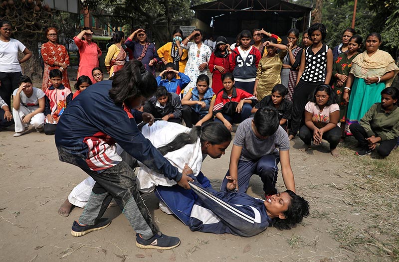 Girls practice a self-defence technique at a training camp in Kolkata, India, on Sunday, December 8, 2019. Photo: Reuters