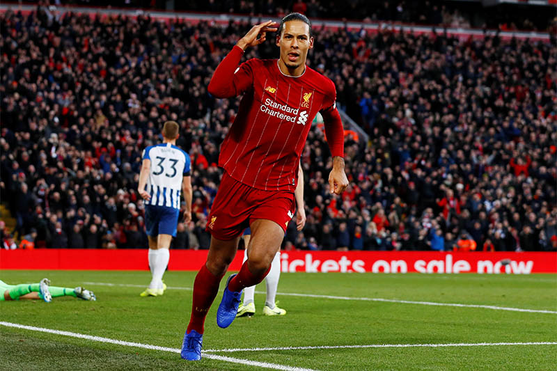 Liverpool's Virgil van Dijk celebrates scoring their first goal. Photo: Reuters