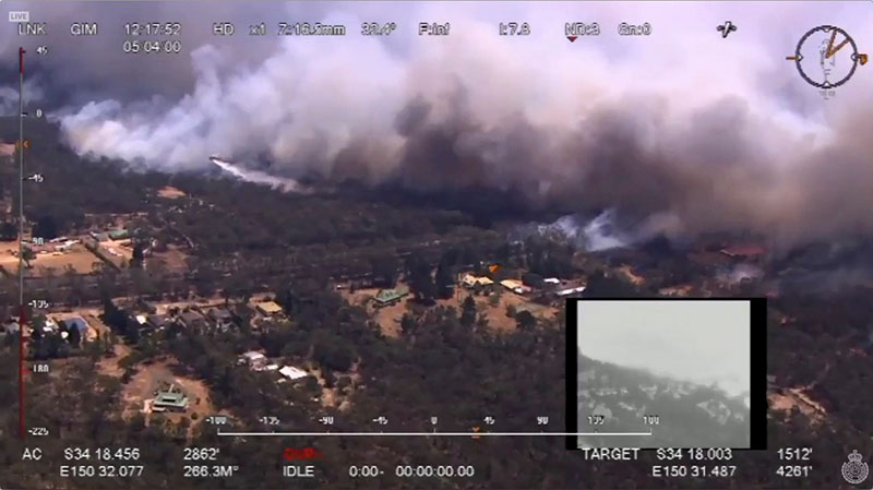 Aerial view shows the Green Wattle Creek fire crossed the railway line near Balmoral, in Wollondilly, New South Wales, Australia, December 19, 2019, in this still image from video obtained via social media. Photo Credit: NSW Rural Fire Service via Reuters