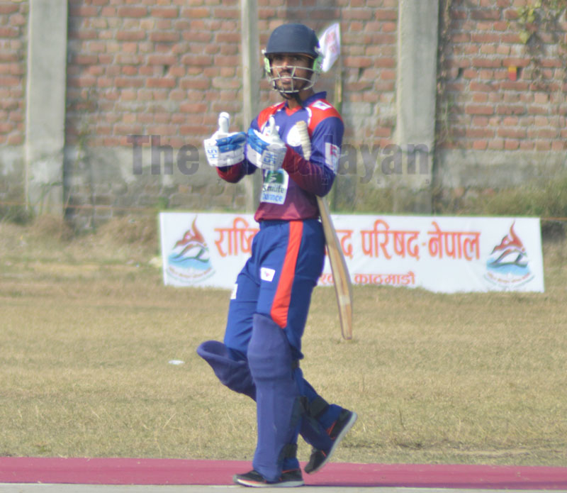 NPCu2019s Sunil Dhamala celebrates after scoring half century against Karnali Province during their Manmohan Memorial National One-Day Cricket Tournament match at the Inaruwa grounds in Sunsari on Wednesday. Photo: THT