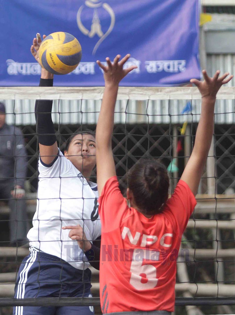 Pratibha Mali (left) of New Diamond Sports Club attempts a spike against NPC during the third Hongwangji New Diamond Open National Womenu2019s Volleyball Tournament in Kathmandu on Friday. Photo: THT