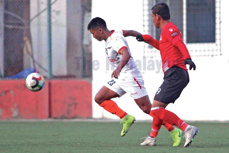 Nepal APF Clubu2019s Ashish Lama (left) vies with Saraswoti Youth Club player during their Qatar Airways Martyrs Memorial A Division League match in Lalitpur on Thursday, January 2, 2020. Photo: Udipt Singh Chhetry / THT