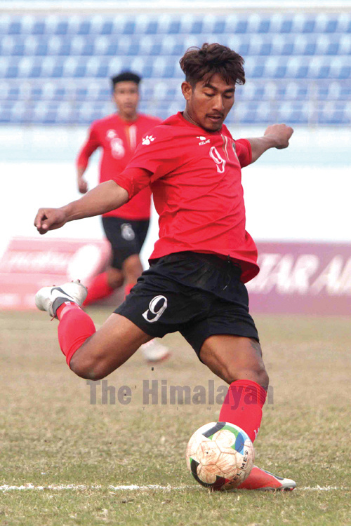 Rajesh Pariyar of New Road Team dribbles the ball against Brigade Boys Club during their Qatar Airways Martyr's Memorial A Division League match at Dasharath Stadium in Kathmandu on Thursday. Photo: Udipt Singh Chhetry/THT