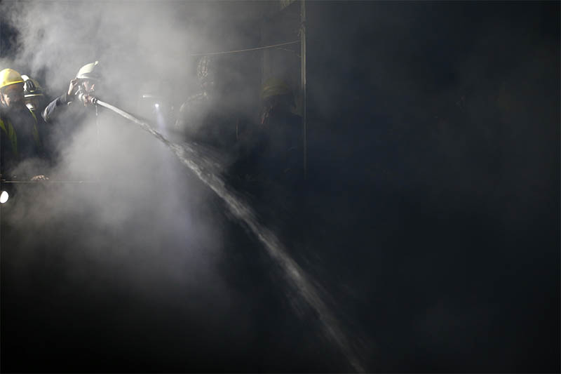 Firefighters along with Nepal Police and Nepal Army work to douse fire at a residential building in Ason, Kathmandu, on Friday, January 03, 2020. Photo: Skanda Gautam/THT