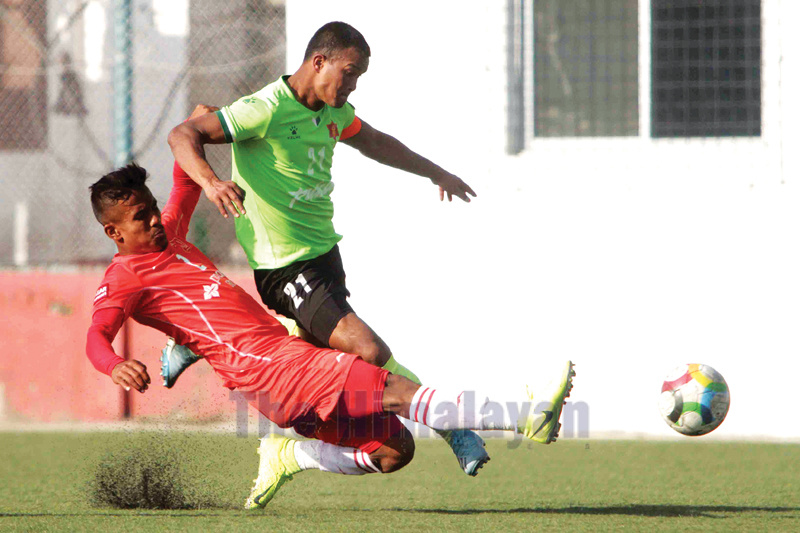Bharat Khawas (right) skipper of Tribhuvan Army Club vies for the ball against Gautam Shrestha of Jawalakhel Youth Club during their Qatar Airways Martyr's Memorial A Division League match at ANFA ground, Satdobato in Lalitpur on Tuesday. Photo: Udipt Singh Chhetry/THT