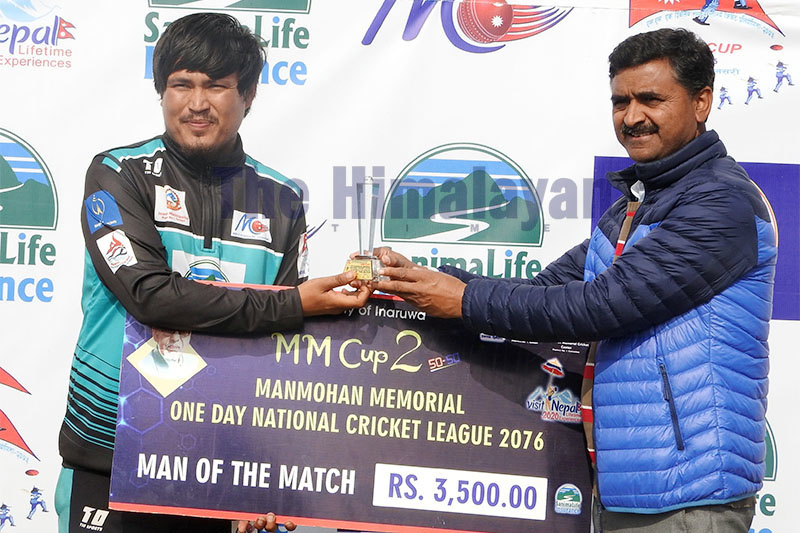 Man of the match of today's fixture, Binod Lama of Sudurpaschim Province, poses for portrait along with guest, after collecting trophy at Inarwa stadium. Photo: Santosh Kafle/THT