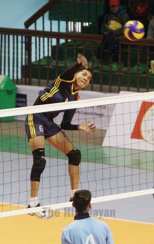 Bishal Bahadur BK of Nepal Police Club jumps to attemept a spiker agianst Nayabazar Social Youth Club during RBB-NVA National Women's /Men's Volleyball Club Championship at NSC covered hall, Tripureshwor in Kathmandu on Wednesday. Photo: Udipt Singh Chhetry/THT