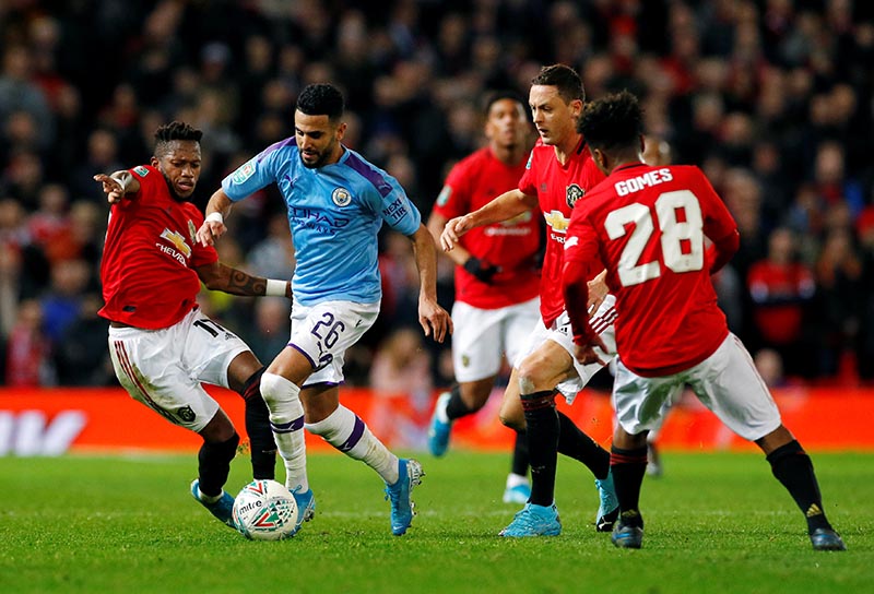 Manchester United's Fred and Nemanja Matic in action with Manchester City's Riyad Mahrez during their Carabao Cup Semi Final First Leg match at Old Trafford, in Manchester, Britain, on January 7, 2020. Photo: Reuters