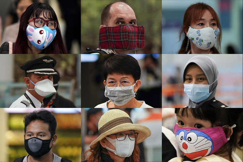 In this combination of photos, people wear various masks as they wait at an immigration counter at an airport terminal in Sepang, Malaysia, outside Kuala Lumpur, Wednesday, Jan 29, 2020. Photo: AP
