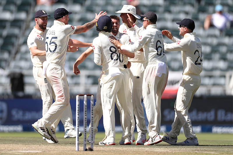 England's Mark Wood celebrates with teammates after taking the wicket of South Africa's Rassie van der Dussen. Photo: Reuters