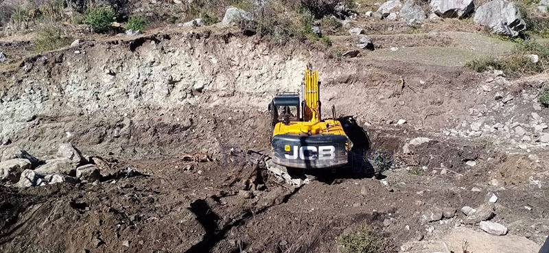 A dozer is being used in the construction of Martadi-Kolti road section, which is being carried out without an Environmental Impact Assessment study. Photo: Prakash Singh/THT