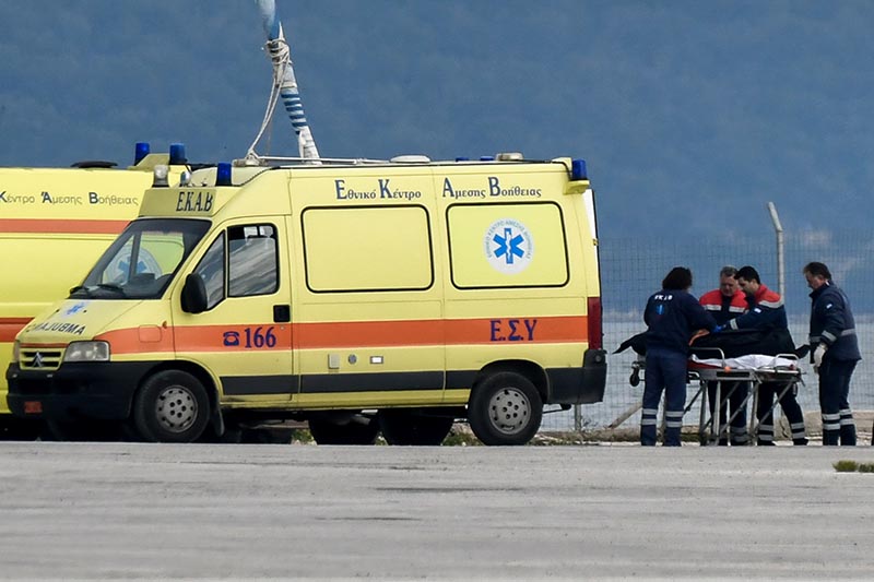 The body of a migrant is pushed by medical staff into an ambulance at the port of Preveza, Greece, January 11, 2020. Yorgos Eusthathiou/Eurokinissi via Reuters