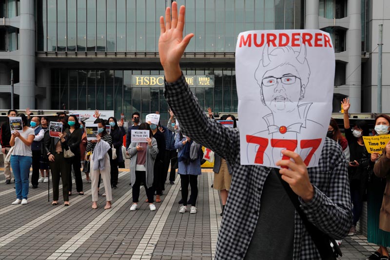 Anti-government protesters take part at a lunchtime protest outside HSBC headquarters in Hong Kong, China January 2, 2020. Photo: Reuters