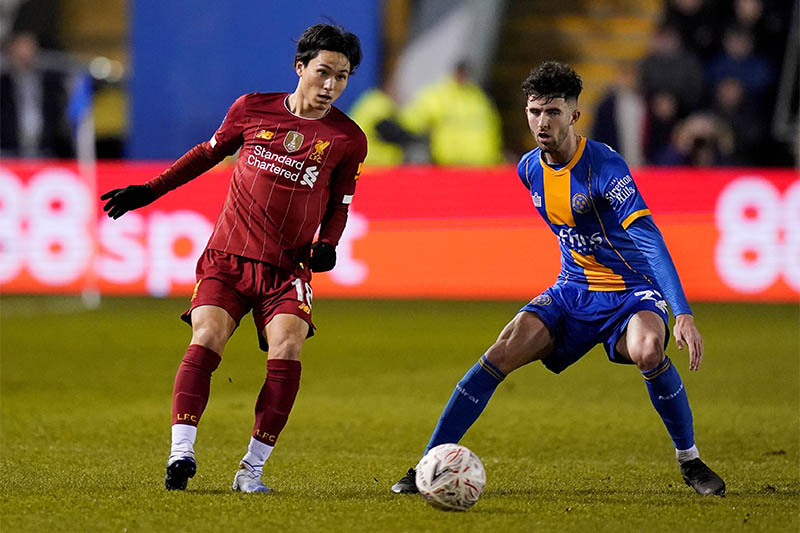 Liverpool's Takumi Minamino in action with Shrewsbury Town's Sean Goss. Photo: Reuters
