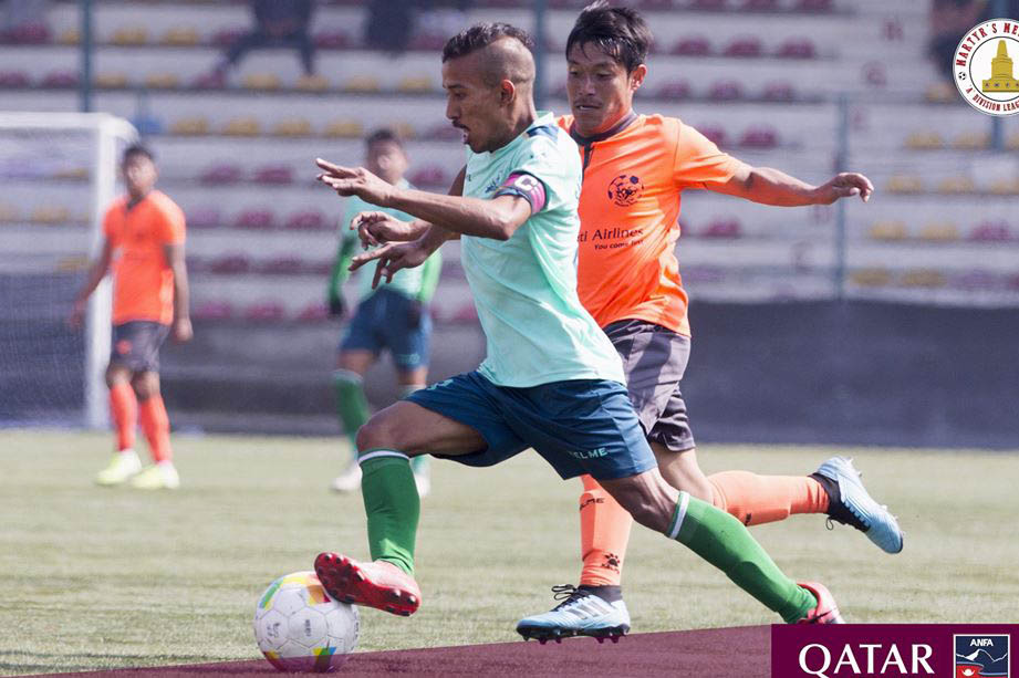 Saraswati Youth Club player (blue jersey) tries to dribble past HSC player during Qatar Airways Martyr's Memorial 'A' Division League, in Lalitpur, on Tuesday, January 28, 2020. Photo: ANFA/Facebook