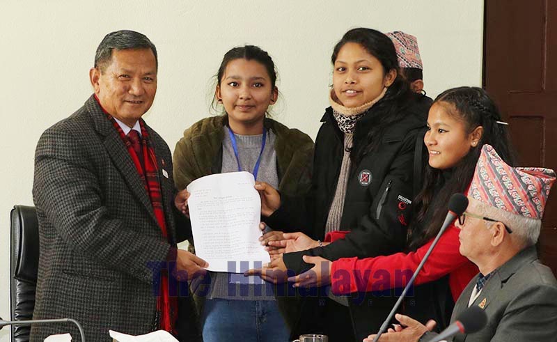 Girls from Nawalpur handing over a 25-point memorandum to Gandaki Province Chief Minister Prithvi Subba Gurung at his residence, in Pokhara, on Wednesday, January 15, 2020. Photo: THT