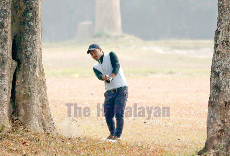 Niraj Tamang hits an approach shot from the 18th hole fairway during the first round of the Surya Nepal Eastern Open at the Nirvana Country Club in Dharan on Tuesday. Photo: THT