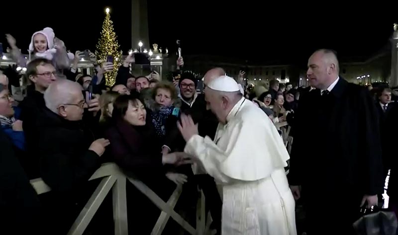 Pope Francis slaps the hand of a woman who grabbed him, at Saint Peter's Square at the Vatican in this still image taken from a video, on December 31, 2019. Photo: Vatican Media/Handout via Reuters
