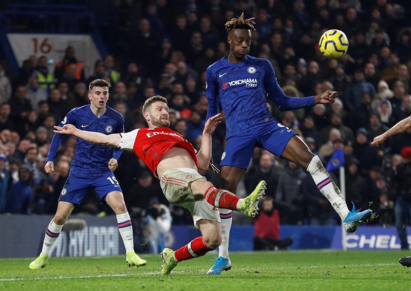 Arsenal's Shkodran Mustafi in action with Chelsea's Tammy Abraham during the Premier League match between Chelsea and Arsenal, at Stamford Bridge, in London, Britain, on January 21, 2020. Photo: Reuters