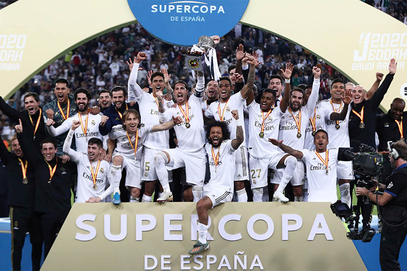 Real Madrid players lift the trophy as they celebrate winning the Super Cup. Photo: Reuters