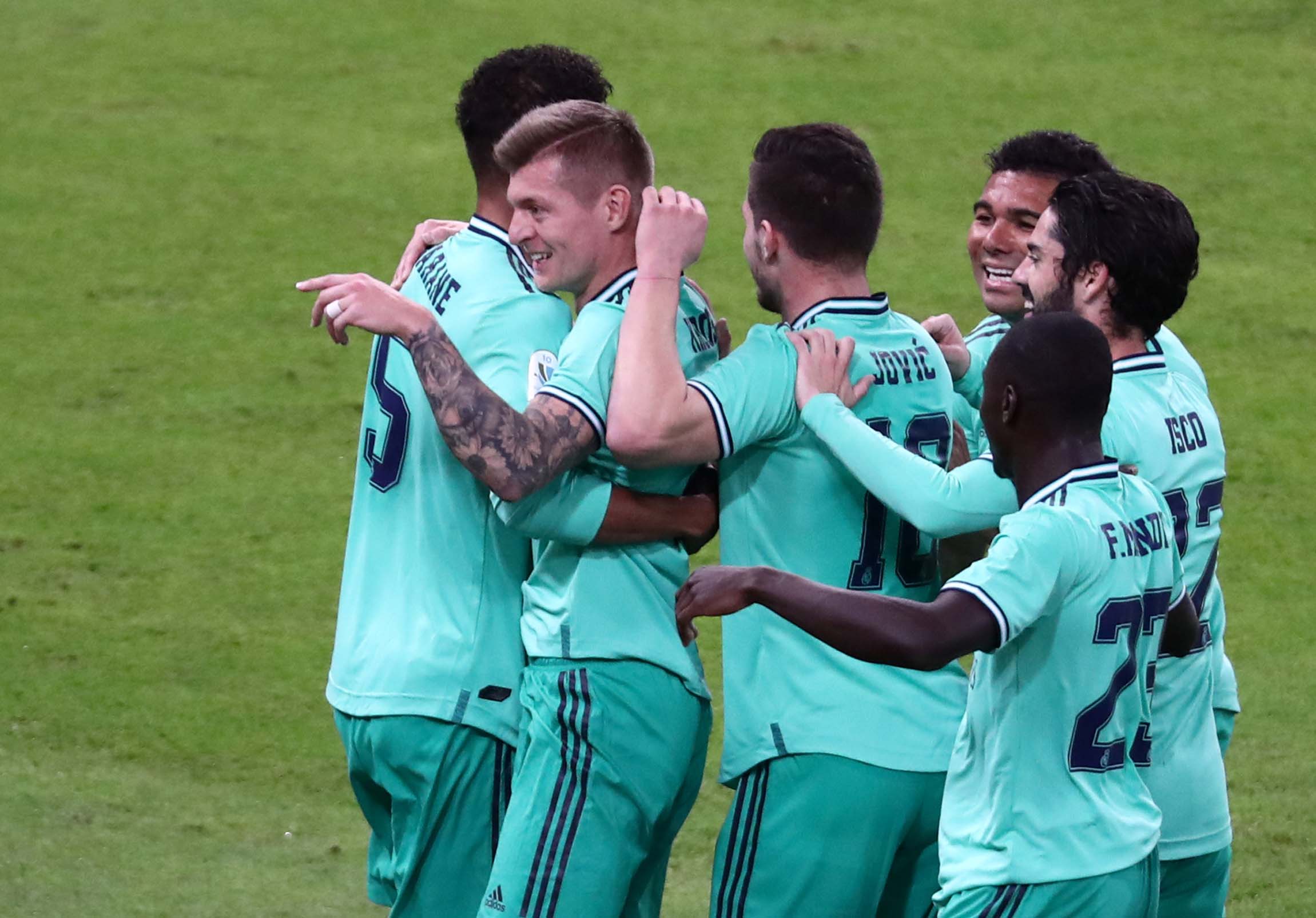 Real Madrid's Toni Kroos celebrates scoring their first goal with teammates during the Spanish Super Cup Semi Final match between Valencia and Real Madrid, at King Abdullah Sports City, in Jeddah, Saudi Arabia, on January 8, 2020. Photo: Reuters