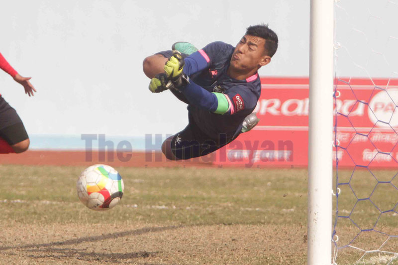 New Road Team goalkeeper Ajit Prajapati dives to save the ball during their Qatar Airways Martyrs Memorial A Division League match against Tribhuvan Army Club at the Dasharath Stadium in Kathmandu on Saturday. Photo: Udipt Singh Chhetry / THT