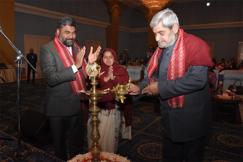 Minister of Federal Affairs and General Administration Hridayesh Tripathi lights 'panas' while Charge du2019Affaires at the Embassy of India, Ajay Kumar (left) claps during a programme organised to mark Vishwa Hindi Diwas, in Kathmandu, on Friday, January 10, 2020 . Minister Tripathi graced the occasion as the chief guest. Photo: Embassy of India Twitter
