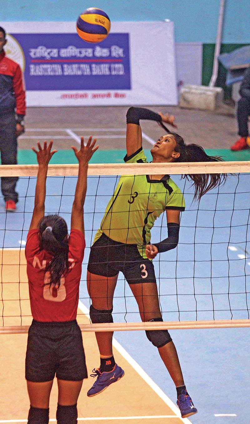 Nepal APF Clubu2019s Saraswoti Chaudhary jumps for a spike against Nepal Police Club during their womenu2019s semi-final match of the RBB-NVA Club Volleyball Championship at the NSC covered hall in Kathmandu on Thursday. Photo: THT