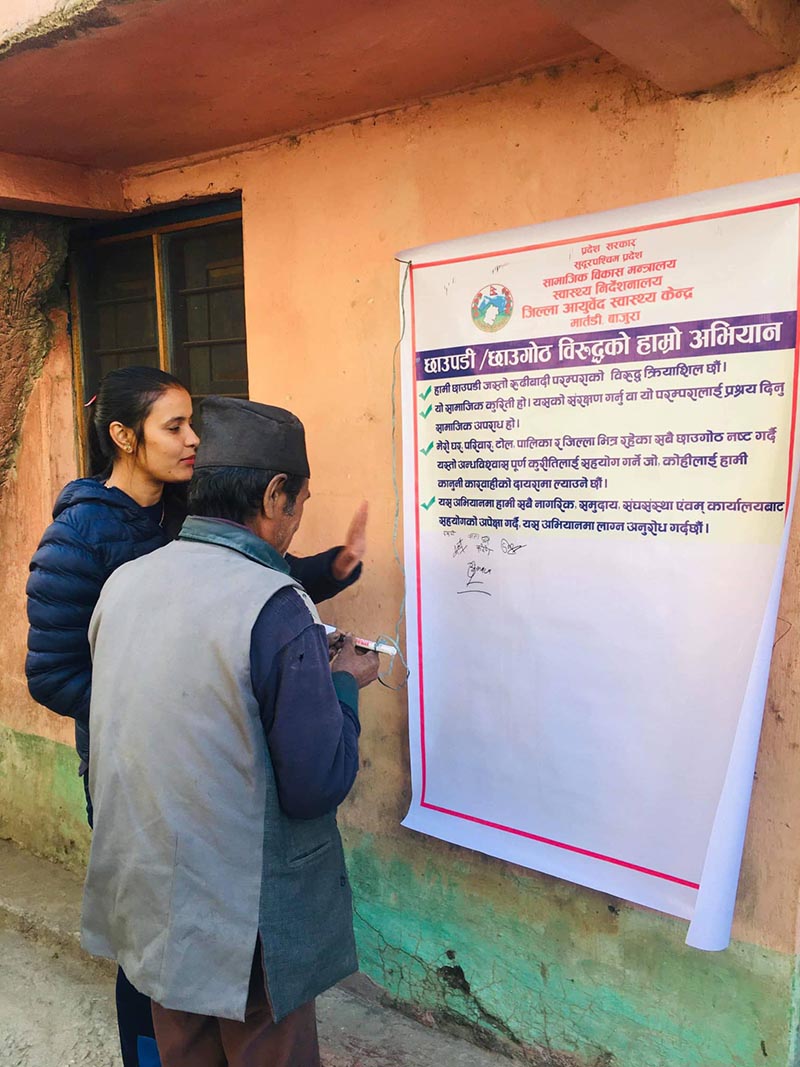 A local signs petition aimed at ending chhaupadi, a social ill practice, in District Ayurvedic Health Centre, in Martadi, Bajura. Photo: Prakash Singh/THT