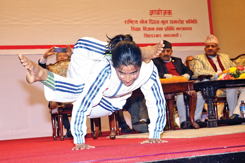 A yoga practitioner demonstrating a complicated posture at a programme organised to mark National Yoga Day, in Kathmandu, on Wednesday. Photo: RSS