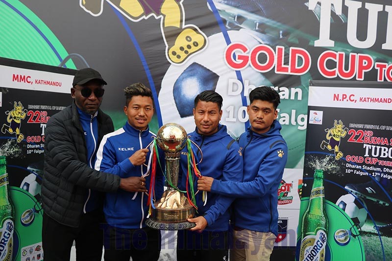 Coaches and skippers of Nepal Police Club and NOC Manang Marshyangdi Club hold the trophy in Dharan on Friday, on the eve of the Budhasubba Tuborg Gold Cup final match. Photo: Santosh Kafle/THT