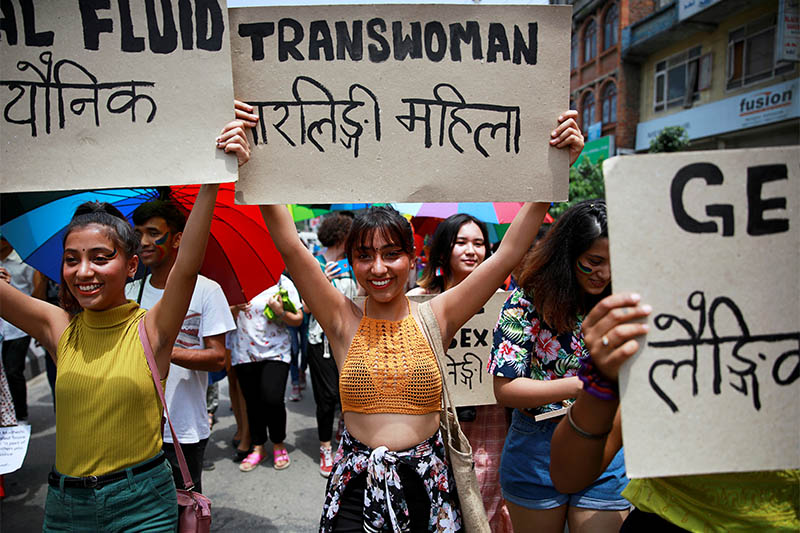 Participants hold up placards while taking part in a Gay Pride parade to mark pride month in Kathmandu, Nepal, June 29, 2019. Photo: Reuters