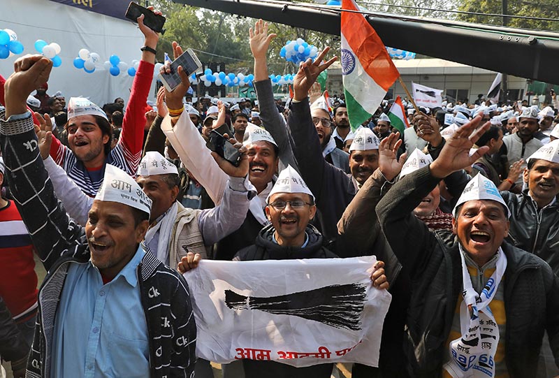 Supporters of Aam Aadmi Party (AAP) celebrate after learning of the initial poll results outside its party headquarters in New Delhi, India, February 11, 2020. Photo: Reuters